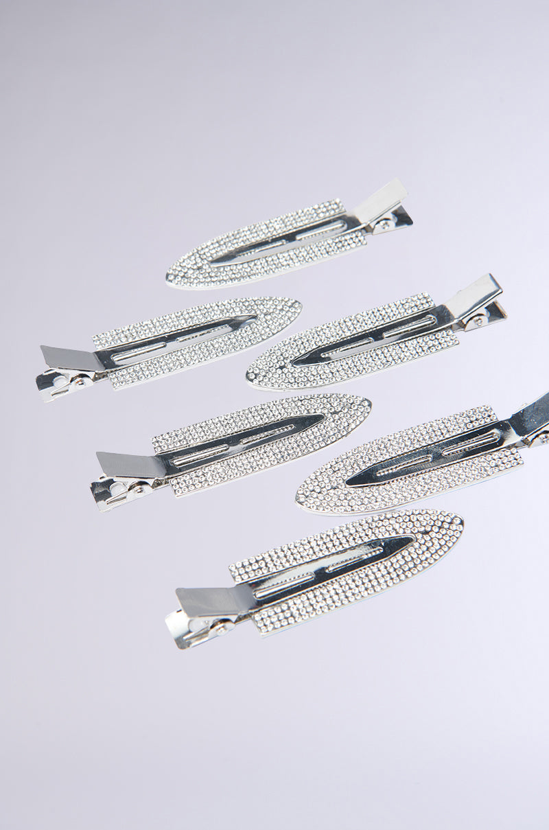 Introducing the TOO PRETTY FOR THIS BLING HAIR CLIPS, a set of six silver hairpins, each beautified with small rhinestone accents and displayed in a zigzag pattern against a light gray backdrop. 5