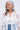 A pretty lady with long, wavy gray hair wears a sheer white floral blouse over a white top and blue jeans. She accessorizes with PRETTY LADY EARRING—flower-shaped earrings with rhinestone centers—and smiles softly to the side.
