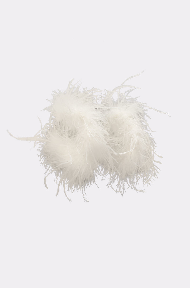 The LET ME FLY HOOP EARRING features a fluffy, feathery white design reminiscent of soft slippers, showcased against a clean white background. 2