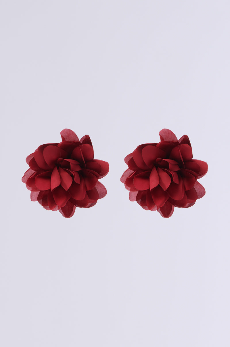 Two FULL BLOOM EARRINGS with red floral designs, featuring layered petals and crafted from satin, are centered against a plain white background. 1