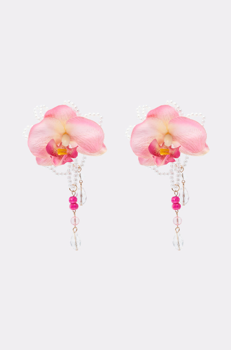 The TO THE TROPICS EARRING features realistic pink orchid flowers with pearl accents, dangling pink beads, and clear teardrop crystals—perfect statement jewelry for floral accessory lovers. 2