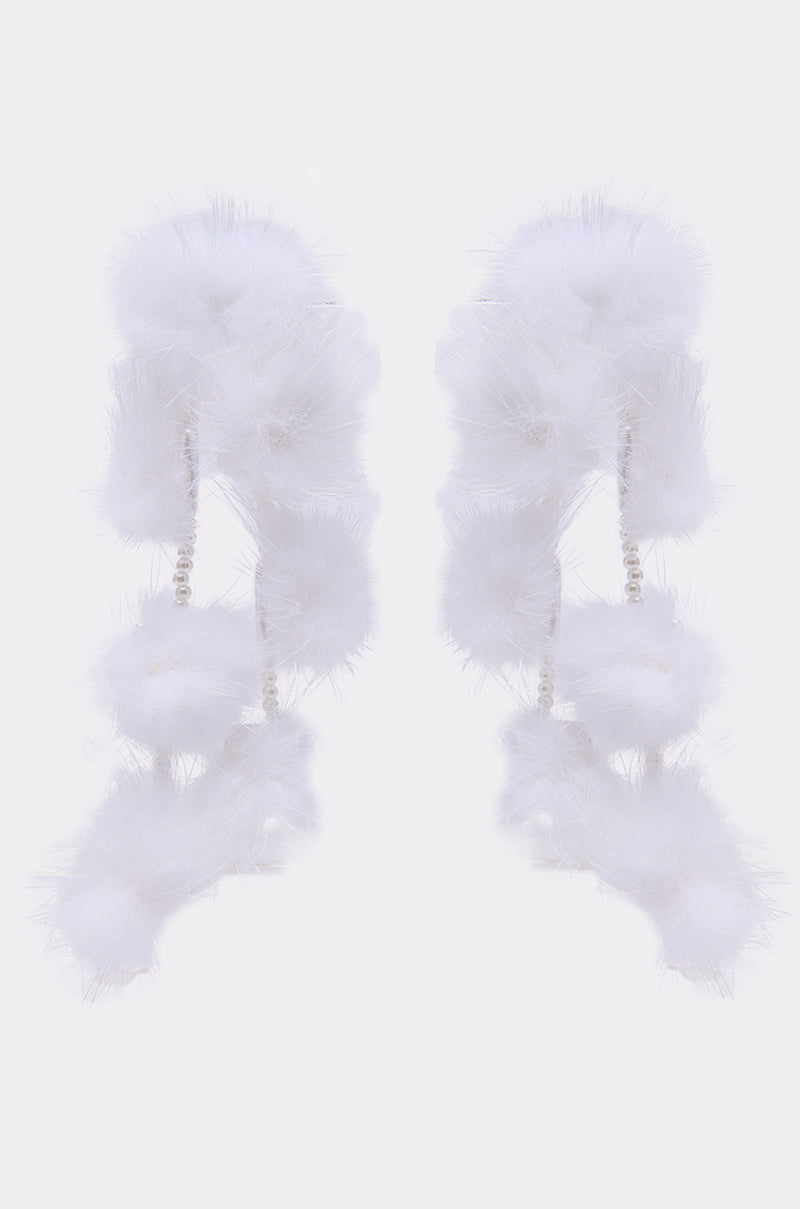 The SNOW PRINCESS EARRING features long, dangling strands with fluffy feather-like pom-poms and small pearl-like beads, beautifully set against a plain white background. 2
