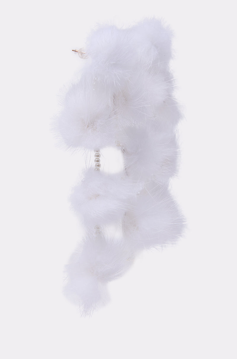 The SNOW PRINCESS EARRING, featuring delicate pearl accents like a fluffy white feather boa, is showcased against a light gray background. 4