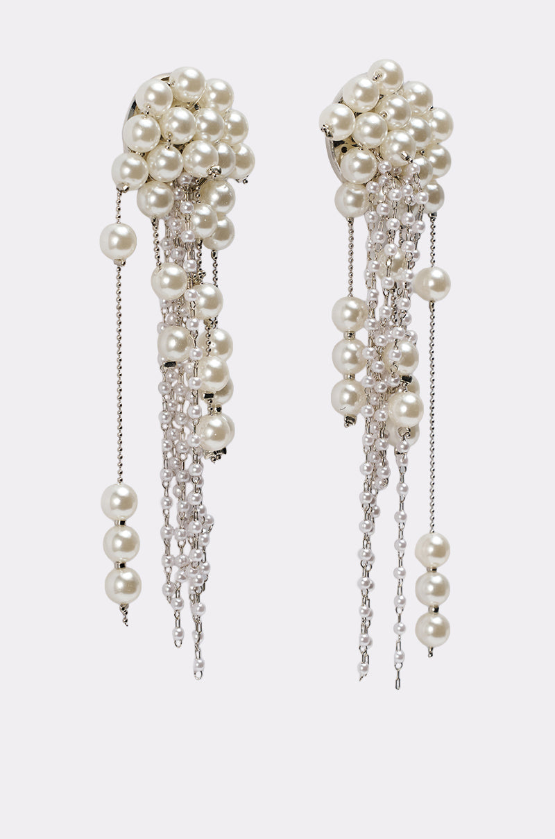 The DRIPPIN IN PEARLS EARRING features clusters of white pearls and cascading silver chains adorned with more pearls, creating a luxurious, elegant statement perfect for special occasions. 3