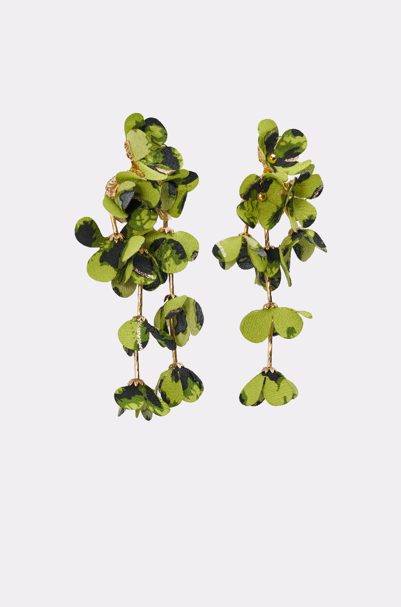 The CATCH ME IF U CAN EARRING features green and black petal-like shapes on gold stems, creating a nature-inspired leafy floral design. 3