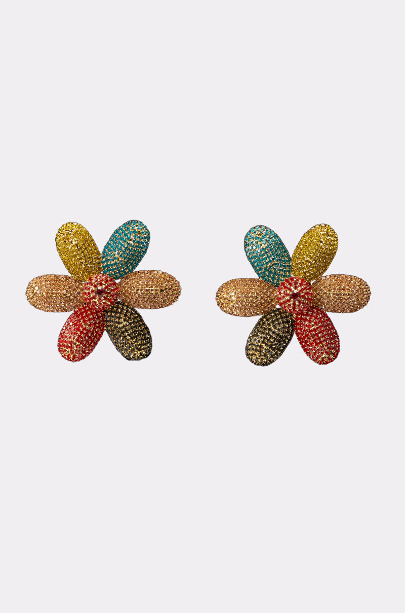 The TAKE ME TO JAPAN EARRING features two vibrant, flower-shaped statement earrings with sparkling, textured petals in red, black, yellow, blue, and gold displayed on a plain white background. 1