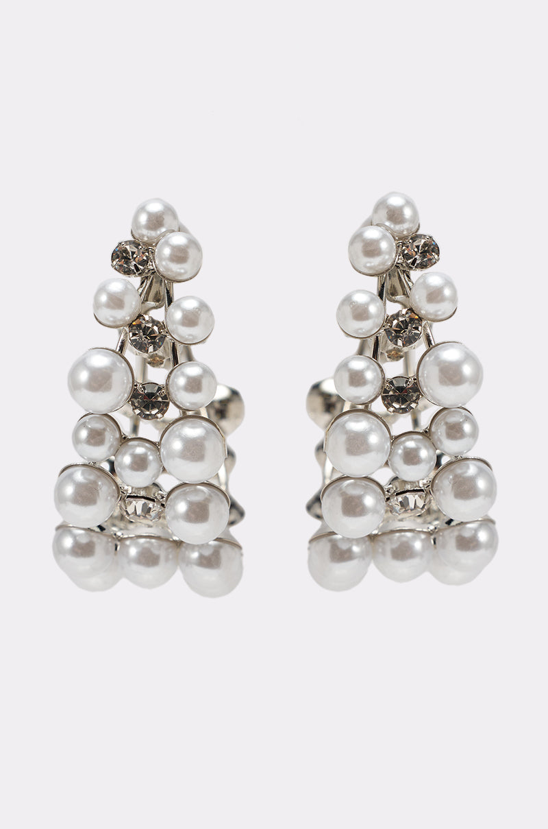 The PEARL PLZ EARRING features silver, triangle-shaped clusters of white faux pearls and clear rhinestones in neat rows. These elegant earrings are perfect for brides and special occasions. 2