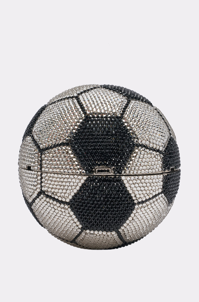 The GOAL BLING BAG is a soccer ball-shaped clutch covered in silver, black, and white rhinestones with a front clasp.