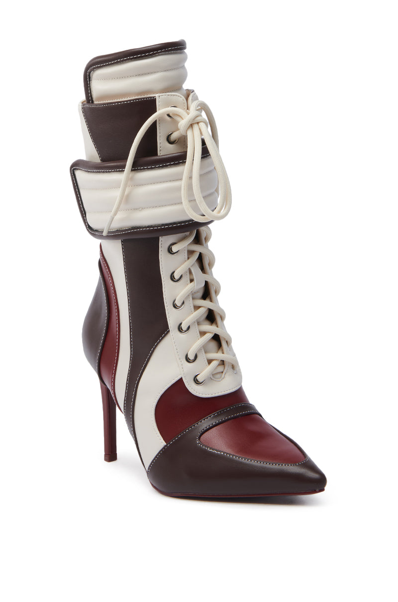 Introducing the AZALEA WANG AMADA BROWN SPORTY STILETTO BOOTIE, a high-heeled bootie with a pointed toe, lace-up design, and color-blocked dark brown, maroon, and white faux leather panels. It features a padded fold-over upper with an elegant stiletto heel.