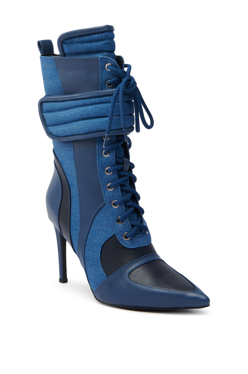 The AZALEA WANG AMADA DENIM SPORTY STILETTO BOOTIE boasts a blue high-heeled ankle style with a pointed toe, lace-up front, and padded collar. It skillfully blends denim and leather textures with layered panels over a chic stiletto heel. 5