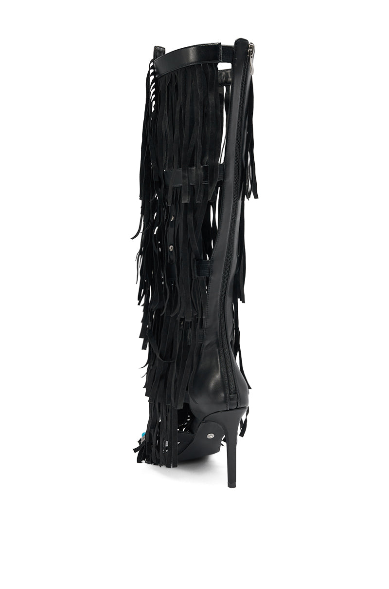 The AZALEA WANG AMADEO Black Fringe and Turquoise Gladiator Stiletto Sandal features a pointed toe, high heel, and layers of long black fringe on the shaft, shown from a side angle against a white background. 6