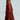 Against a plain background, a person wears the AZALEA WANG AMADEO RED SANDAL—red knee-high fringe boots with turquoise gemstone embellishments. These open-toed gladiator-style sandals offer a unique and stylish edge.