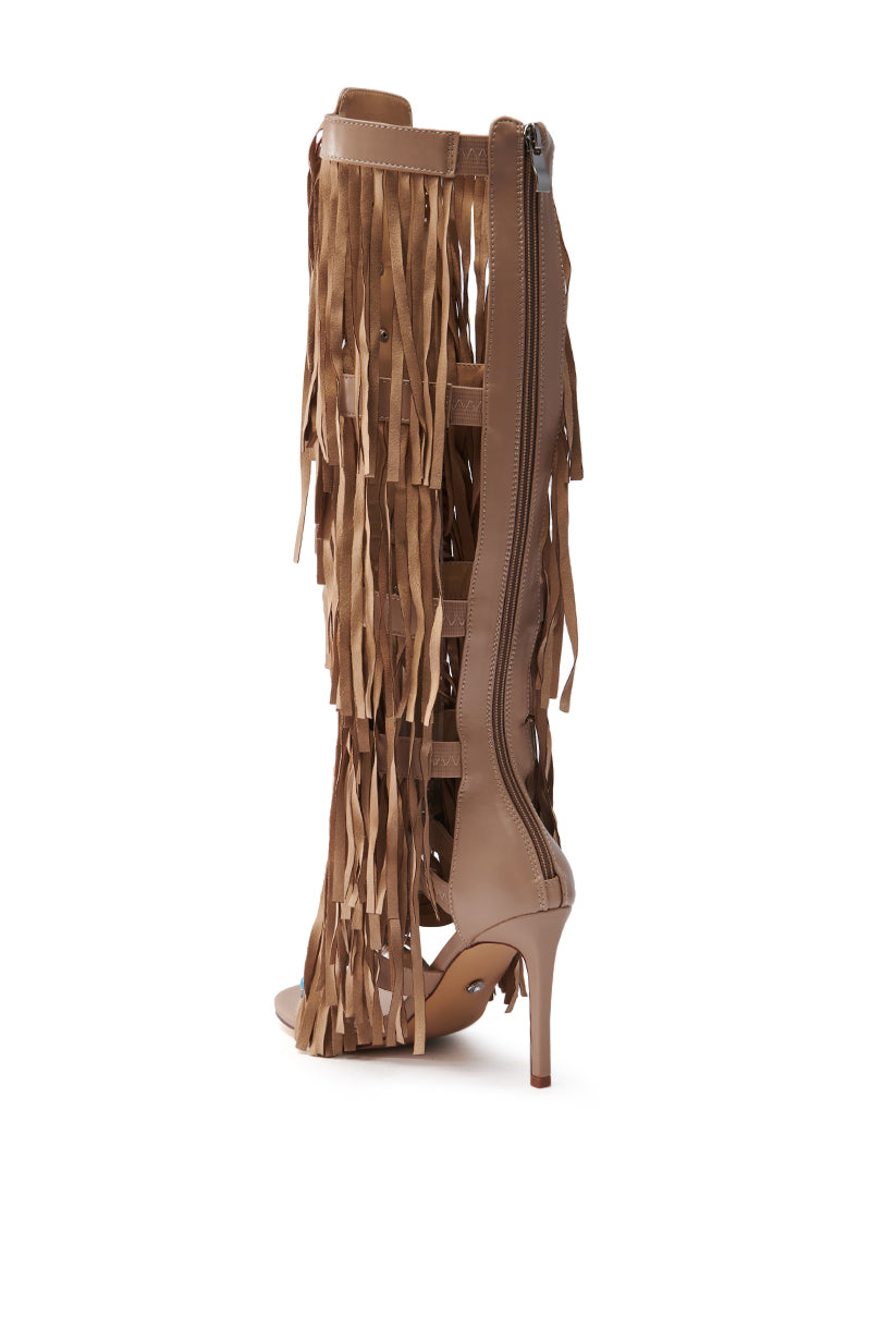 The AZALEA WANG AMADEO TAN SANDAL is a brown faux leather, knee-high boot with open toes, high heels, vertical zipper closure, and decorative fringe layers cascading down the sides.