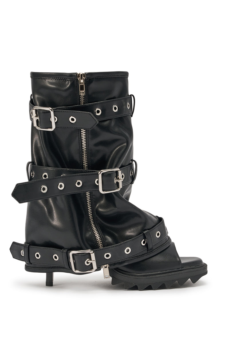 The AZALEA WANG AMES BLACK PU HARDWARE EMBELLISHED STILETTO BOOTIE features black faux leather, multiple buckled straps, silver eyelets and zippers, an open toe, low stiletto heel, and a chunky jagged front sole. 3