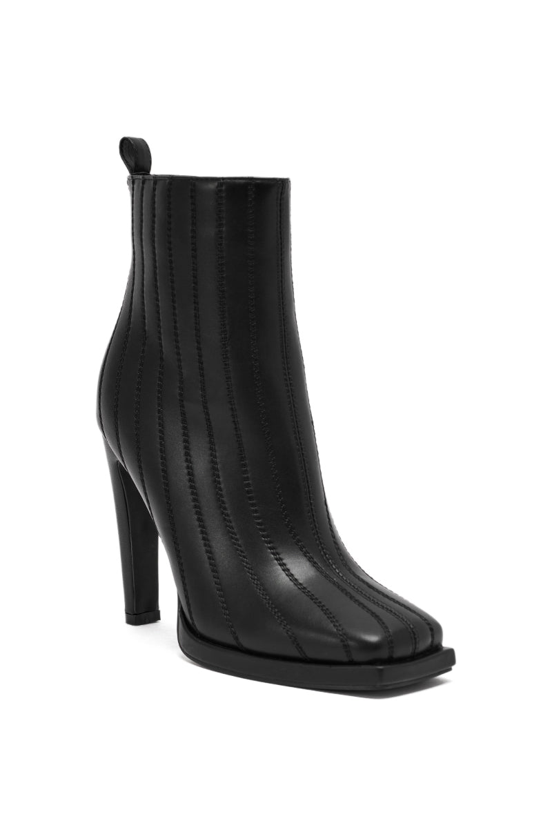 The AZALEA WANG AMHERST BLACK PU BOOTIE features a chunky heel, vertical stitched detailing, square toe, and a pull tab at the back, shown against a white background.