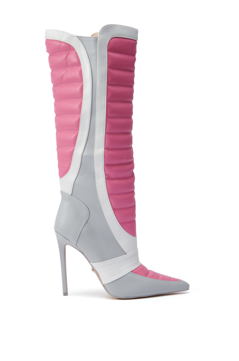 The AZALEA WANG AMORETTA PINK COLOR BLOCK STILETTO BOOT is a trendy mid-calf boot featuring a gray pointed toe and stiletto heel. It showcases a pink quilted shaft accented with white, offering a futuristic and stylish appearance that is sure to turn heads.