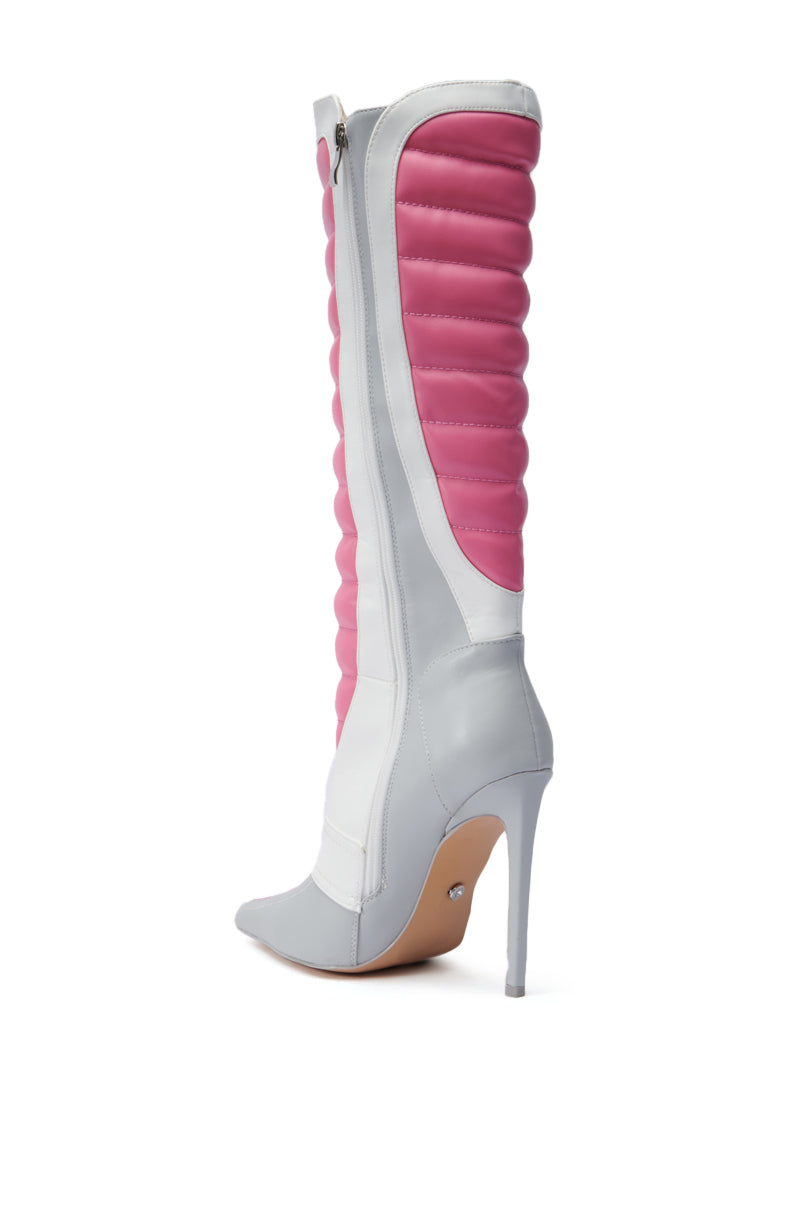 The AZALEA WANG AMORETTA PINK COLOR BLOCK STILETTO BOOT offers a high-heeled design with a pointed toe and a striking tall gray stiletto heel. It features mid-calf, faux leather padding inspired by racing styles in gray and pink panels along the shaft, along with a side zipper for easy closure.