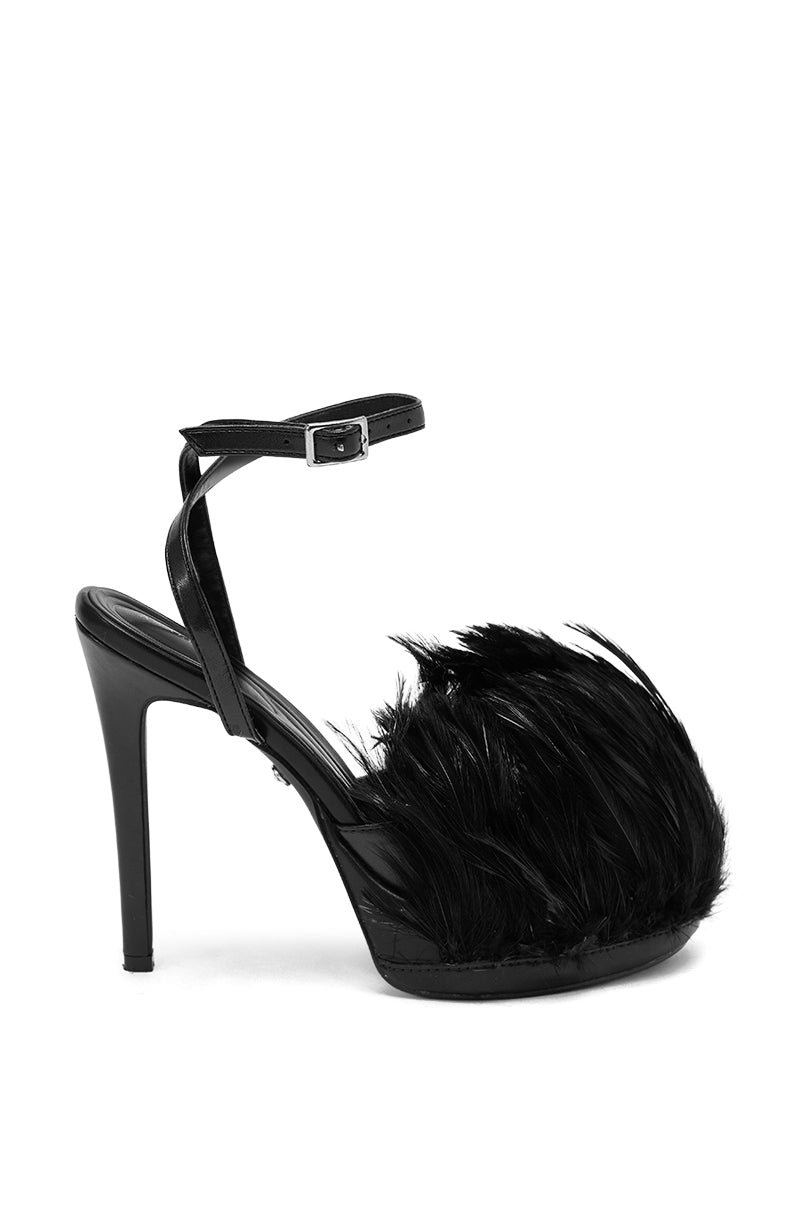Meet the AZALEA WANG ANGELES BLACK FEATHER STILETTO SANDAL—vegan leather stilettos with a platform heel, ankle strap, and dramatic black feathers on the front for bold style.