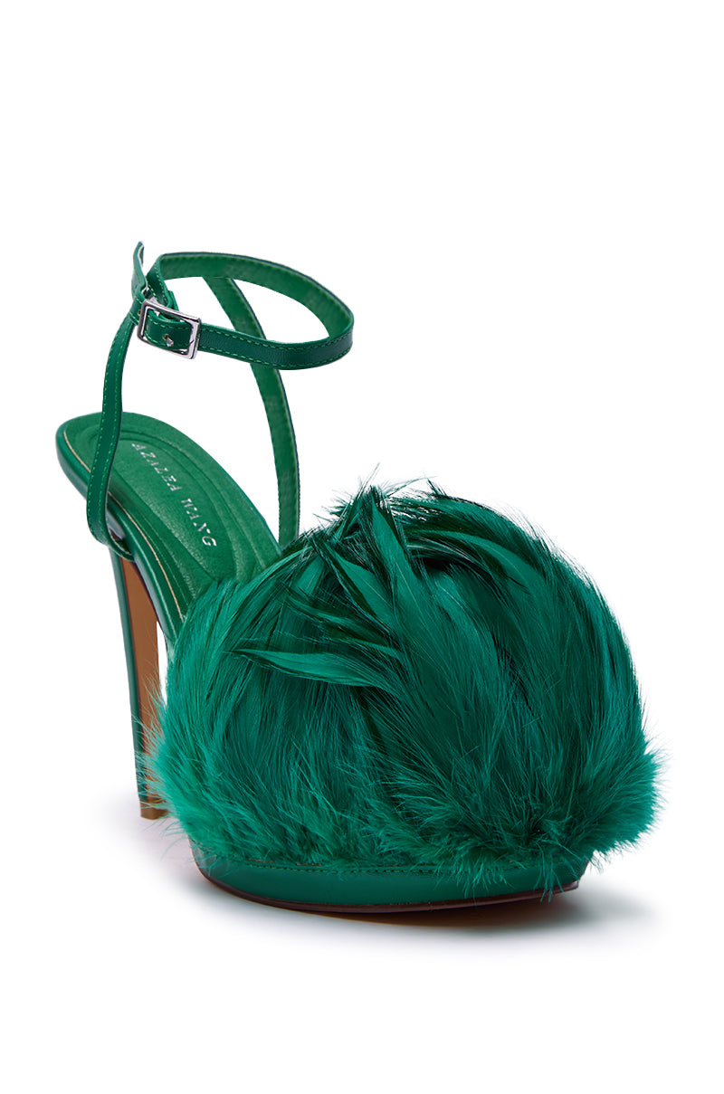 The AZALEA WANG ANGELES GREEN FEATHER STILETTO SANDAL features an ankle strap, platform sole, and a bold feather embellishment across the faux leather front.
