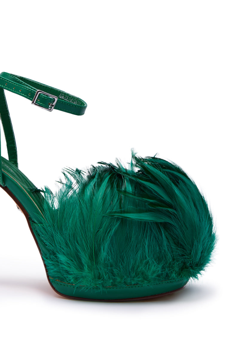 The AZALEA WANG ANGELES GREEN FEATHER STILETTO SANDAL showcases a faux leather heel, silver buckle strap, and vibrant green feathers at the toe.