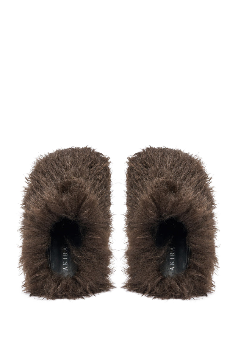The AKIRA ANGOL CHOCOLATE SHAGGY FLAT SLIPPER features a cozy faux fur texture, chocolate color, black insoles, and an open-back flat design—perfect comfy slippers shown from above. 2