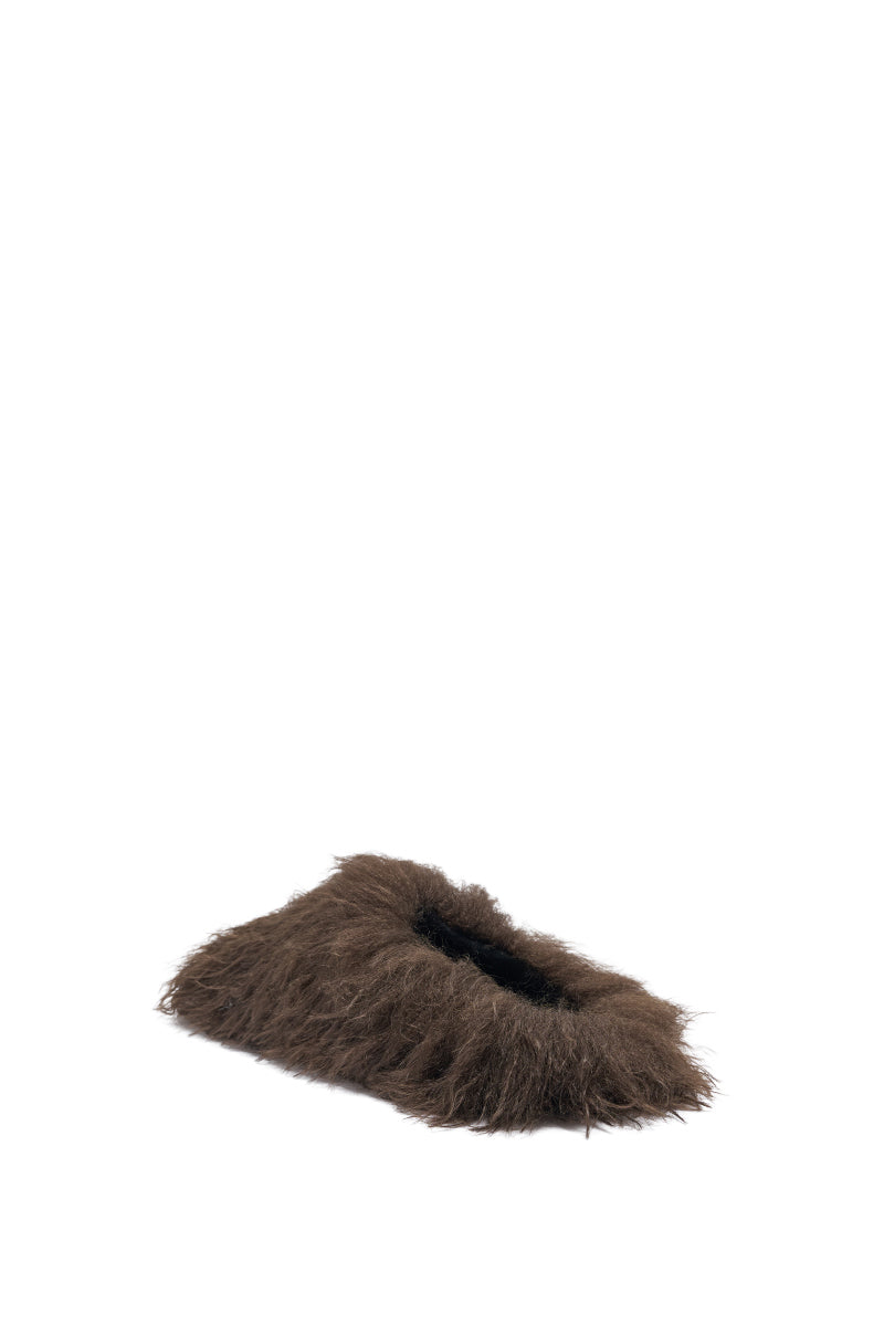 The AKIRA ANGOL CHOCOLATE SHAGGY FLAT SLIPPER, featuring a soft faux fur texture, is shown against a plain white background. 5