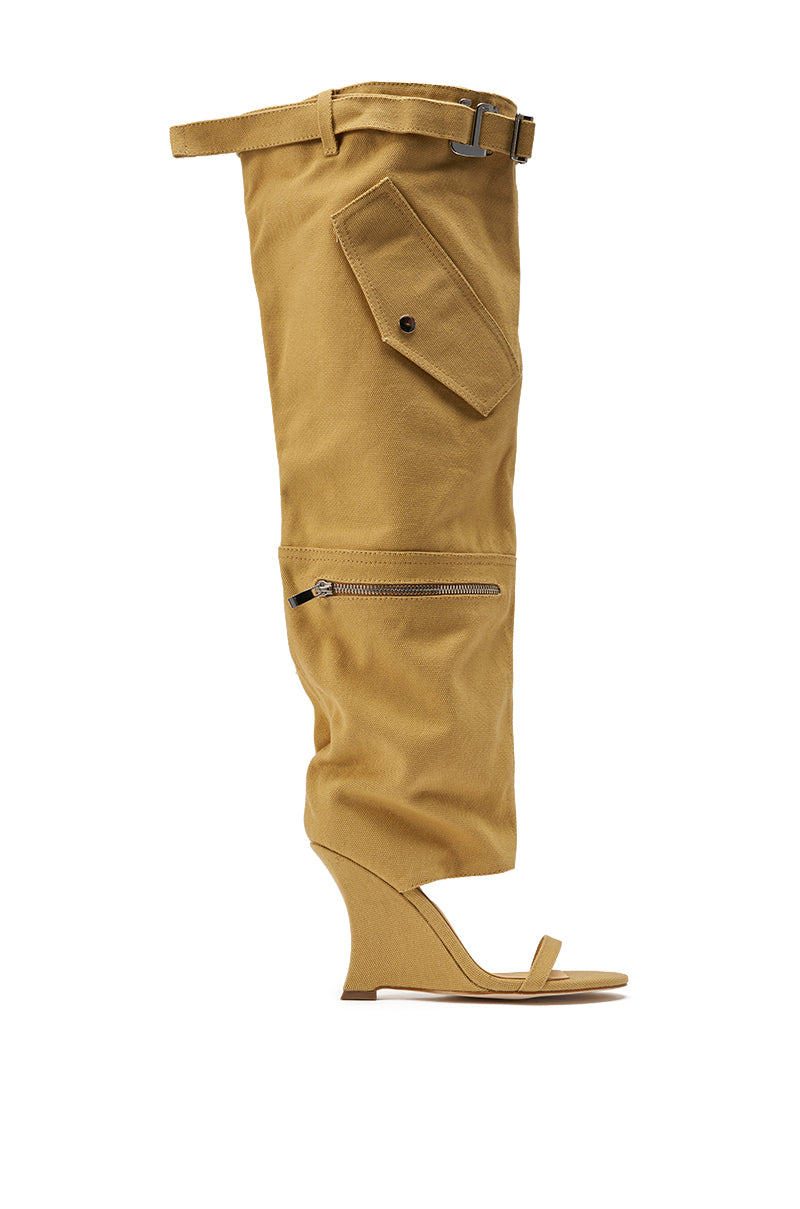 The AZALEA WANG ANOUK KHAKI SPORT WEDGE BOOT is a high-heeled, open-toe wedge with a tall khaki shaft, belt, buttoned pocket, and zipper—ideal for standout street style flair. 3
