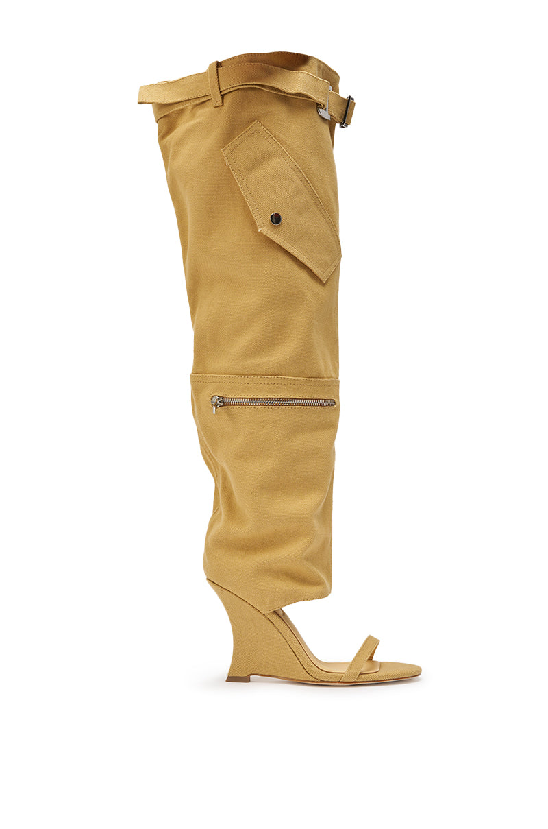 The AZALEA WANG ANOUK KHAKI SPORT WEDGE BOOT is a unique street style tan knee-high boot with an open toe, sandal-style front strap, fold-over top, outer zipper detail, and side pocket with button flap on a wedge heel. 7
