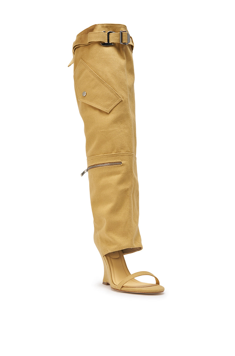 Pairing tall tan pants with the AZALEA WANG ANOUK KHAKI SPORT WEDGE BOOT delivers an effortlessly chic street style look. 8