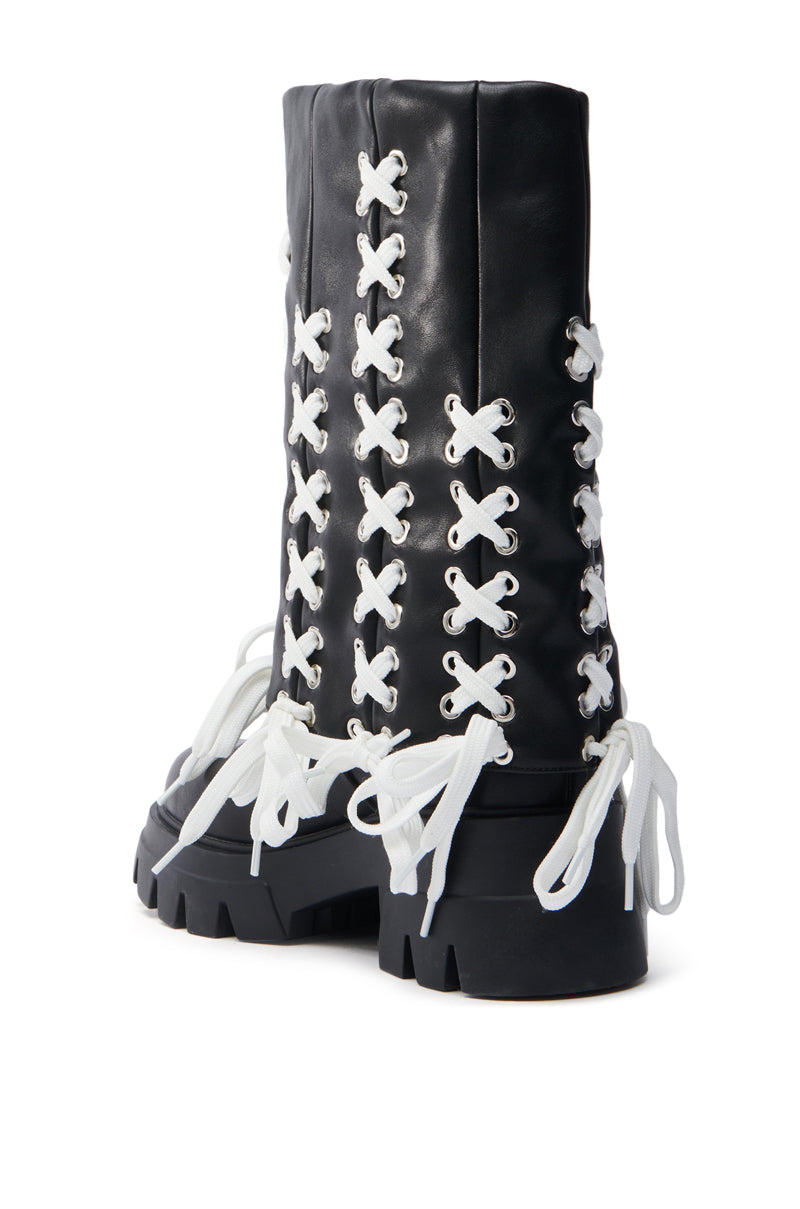 Faux leather AZALEA WANG ANSELM BLACK LACE TIE BOOTIE features chunky soles, white X-pattern laces from ankle to top, and large bows at the base, offering a chic flair.