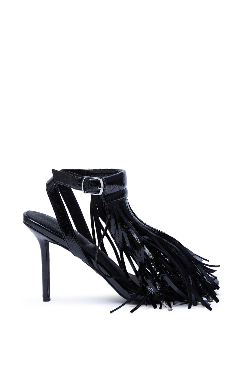 The AZALEA WANG ANTIQUE BLACK FRINGE UPPER STILETTO SANDAL features an ankle strap with silver buckle and decorative black fringe on the side and front, crafted from sleek faux patent leather for a bold statement.
