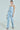 I DONT CHASE I ATTRACT DISTRESSED LIGHT BLUE DENIM JUMPSUIT