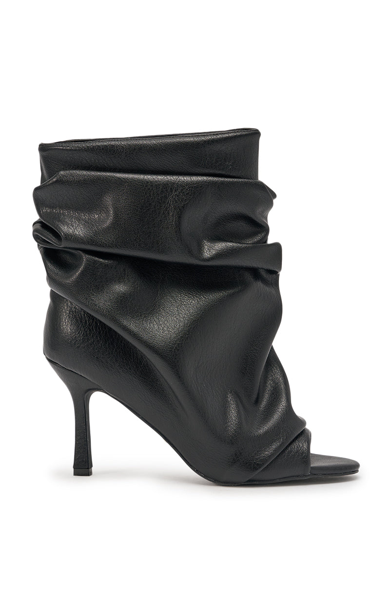 The AZALEA WANG APEX Black Slouchy Open Toe Bootie features a ruched faux leather design and a sleek mid-height stiletto heel, blending modern sophistication with stylish comfort. 3