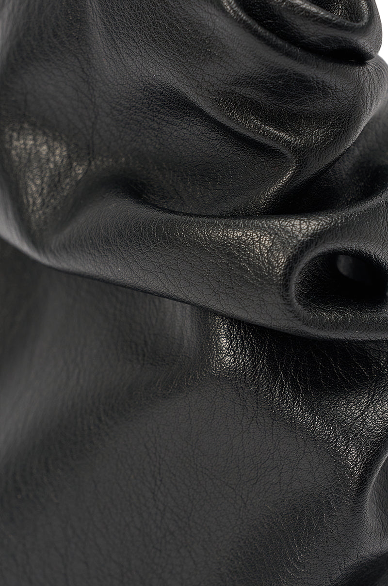 Close-up of black leather fabric with a smooth, slightly glossy surface and natural texture—ideal for crafting the AZALEA WANG APEX BLACK SLOUCHY OPEN TOE BOOTIE. 6