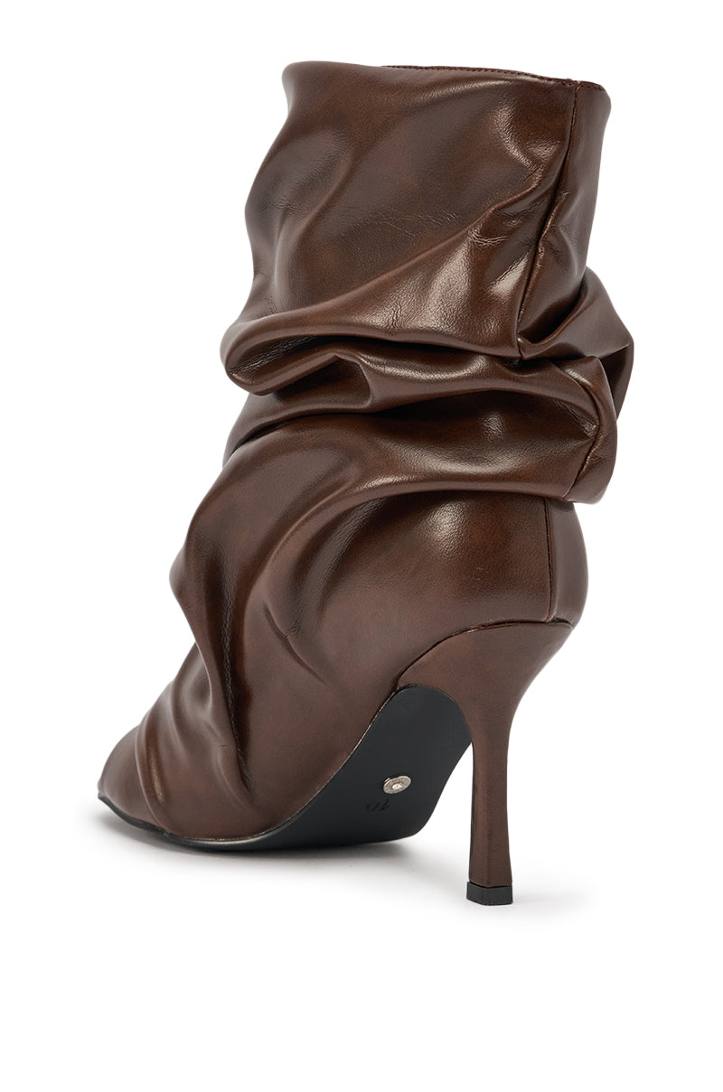 The AZALEA WANG Apex Brown Slouchy Open Toe Bootie features a chocolate faux leather finish, stiletto heel, gathered mid-calf design, and is shown from the back and side on a white background. 6