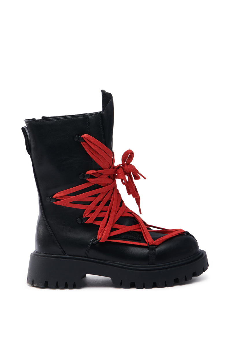 The AZALEA WANG ARJUN Lace Detail Combat Bootie in black features striking red laces and a chunky sole, blending classic and contemporary styling with a modern twist on the timeless combat bootie.