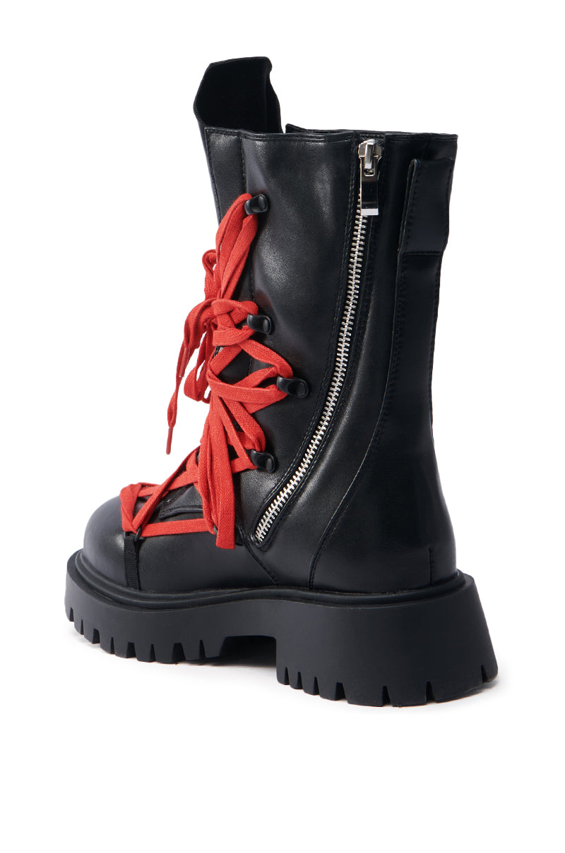 The AZALEA WANG ARJUN Lace Detail Combat Bootie in black features red crisscross laces, a silver side zipper, chunky heel, high ankle design, and visible stitching.