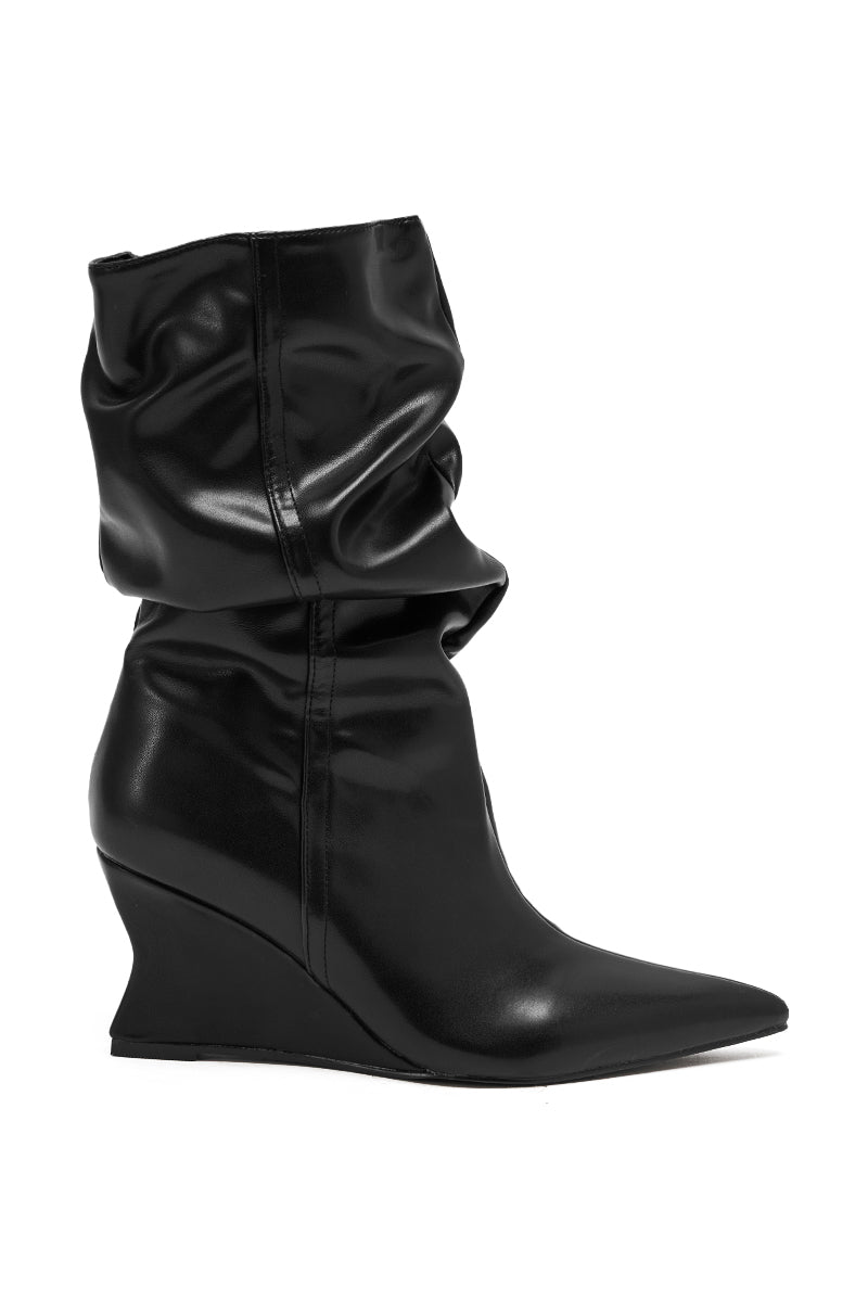 The AZALEA WANG ASAF RUCHED WEDGE BOOTIE IN BLACK features a pointed toe and slouchy, ruched faux leather upper, shown against a white background.