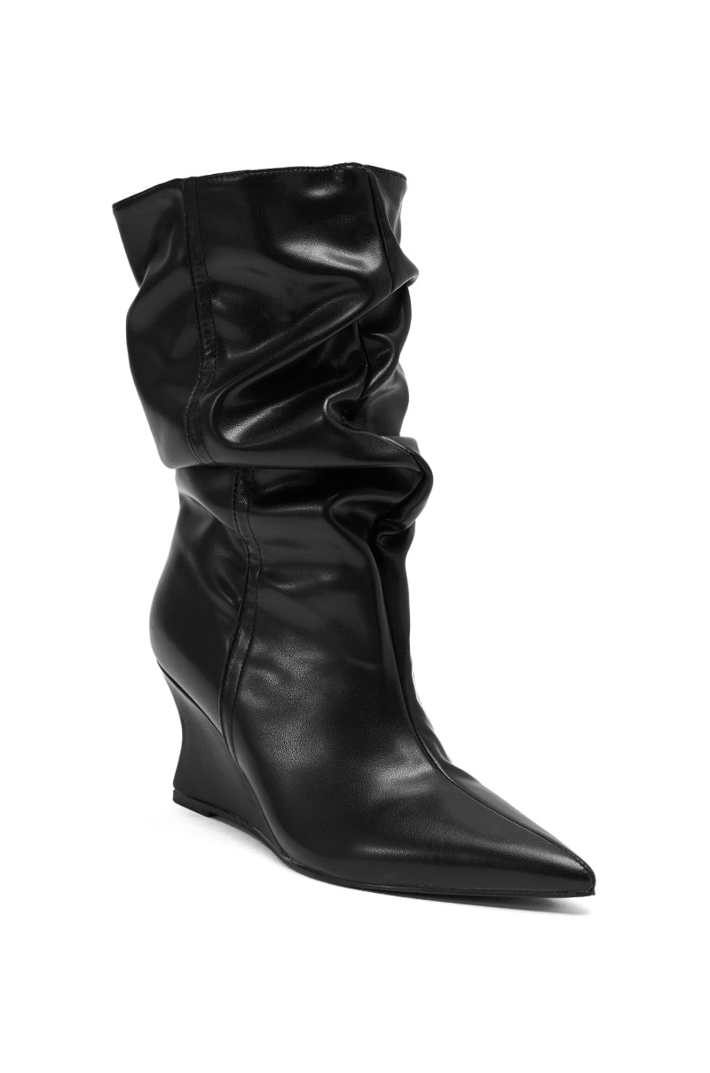 The AZALEA WANG ASAF Ruched Wedge Bootie in black features a pointed toe, mid-calf height, ruched design, and a shiny faux leather-like finish, shown against a white background.