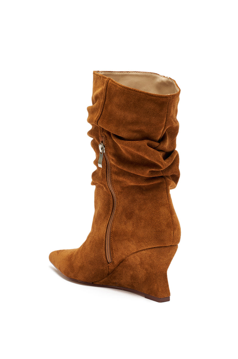 The AZALEA WANG ASAF RUCHED WEDGE BOOTIE IN TAN features a pointed toe, wedge heel, and side zipper. Displayed against a white background.