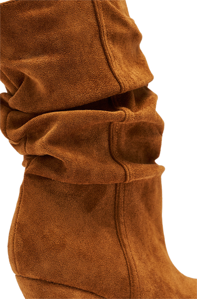 Close-up of the AZALEA WANG ASAF Ruched Wedge Bootie in Tan, showcasing its soft suede texture, visible stitching, and rich color.
