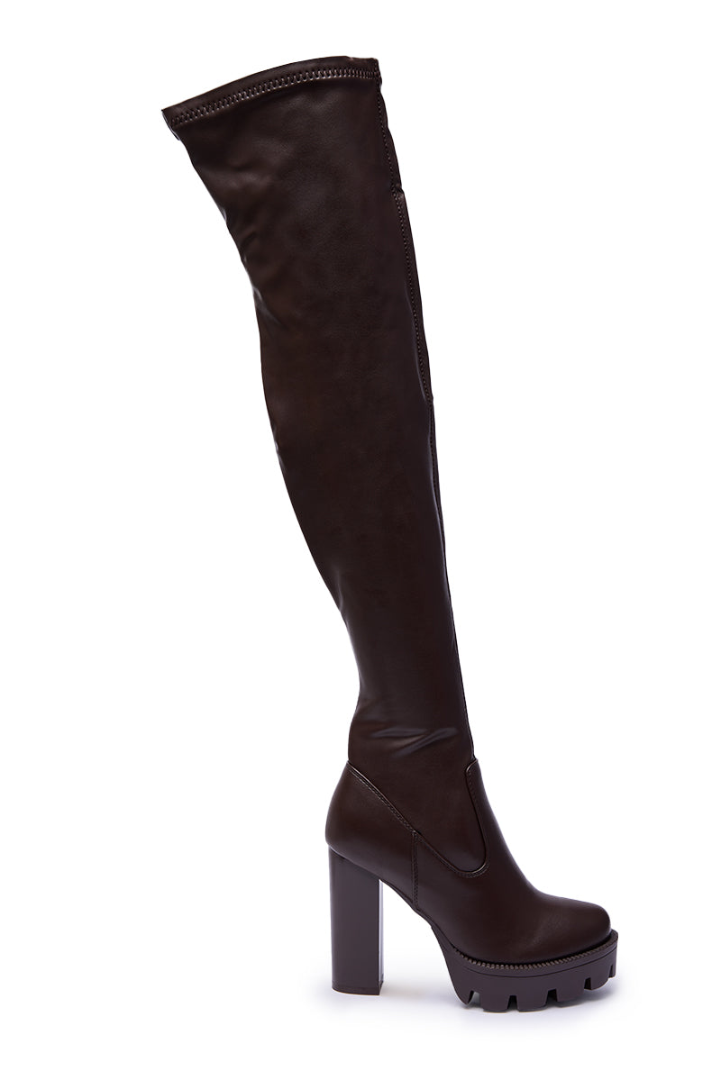 The AZALEA WANG ASHLAND Chocolate Stretch PU Chunky Thigh-High Boot features an over-the-knee design, block heel, and thick sole, shown in side profile against a white background.