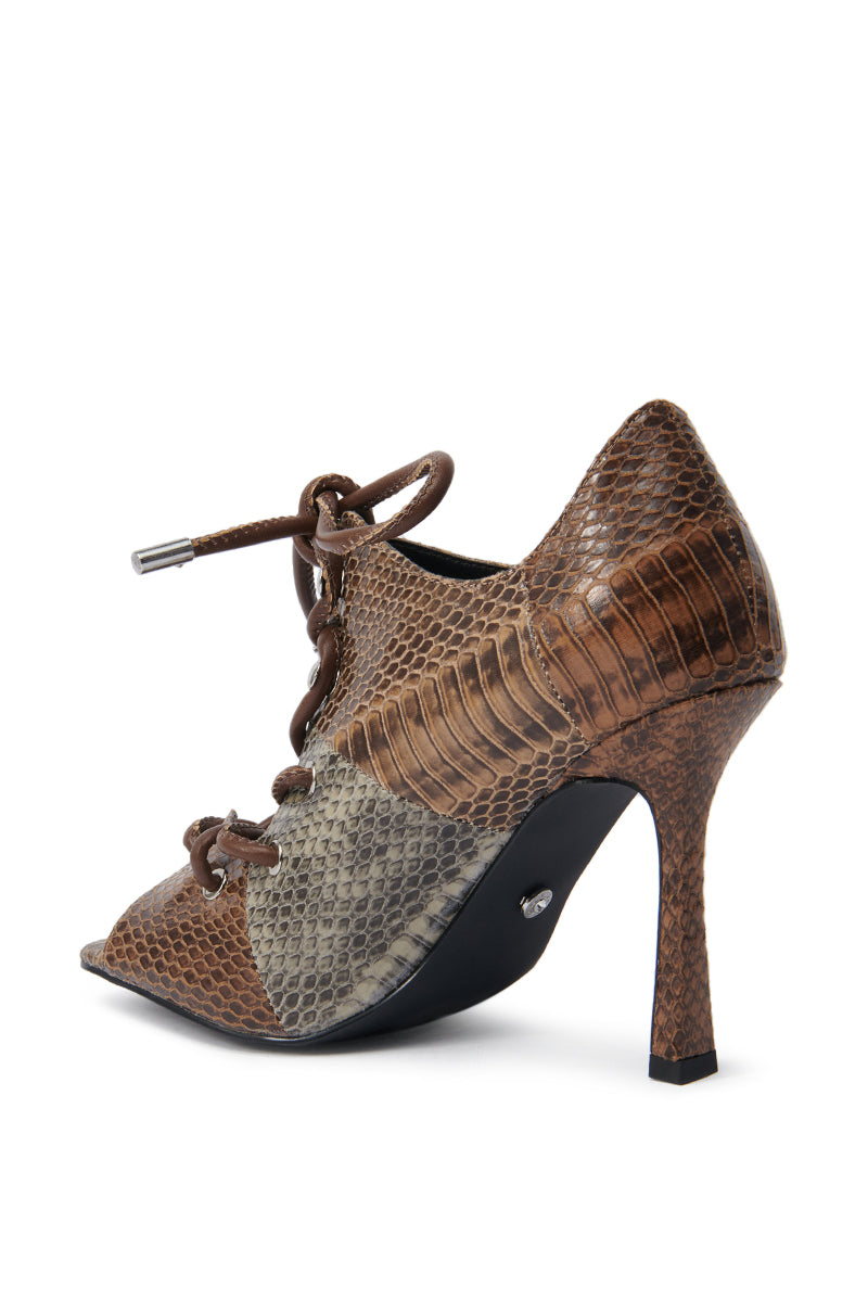 The AZALEA WANG ASHLIE Color Blocked Snake Sandal features brown and gray faux leather with a snakeskin pattern, pointed toe, lace-up front, and stiletto heel, shown from the side on a white background. 5