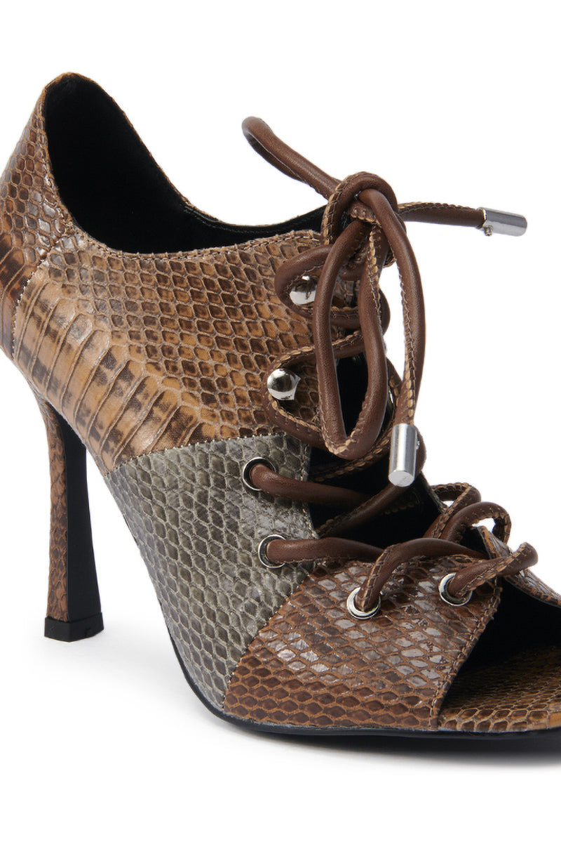 The AZALEA WANG ASHLIE COLOR BLOCKED SNAKE SANDAL is a high-heeled, lace-up stiletto with open sides, brown and gray snakeskin pattern, metallic eyelets, and crafted from faux leather. 6