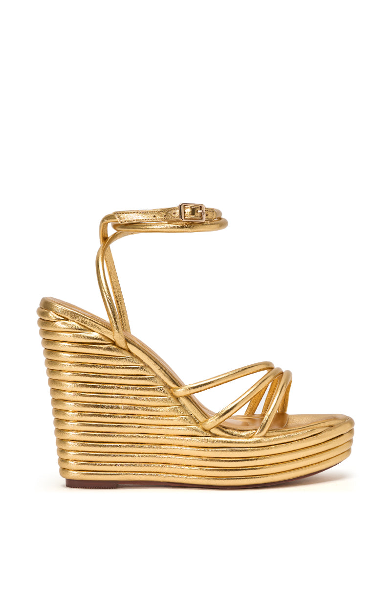 The AZALEA WANG AVENY Gold Strap Round Toe Wedge Sandal features a metallic gold finish, comfort cushion insole, thin crisscross toe straps, ankle buckle, and a high platform wedge with a bold horizontal ribbed texture. 3