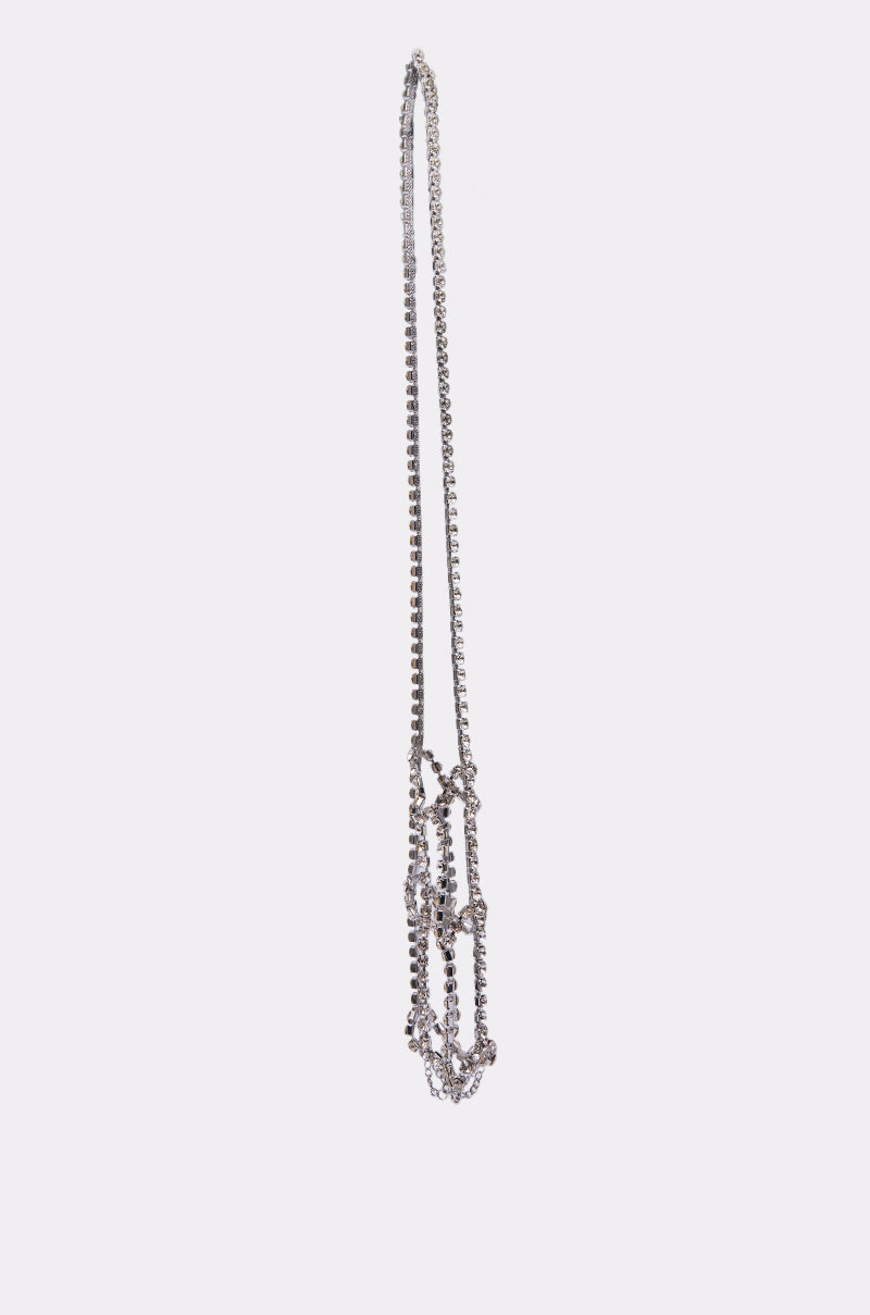 The CARRY IT BLING WATER BOTTLE HOLDER features a long silver chain with small, round beads, shown arranged in a loose, vertical loop against a plain white background.