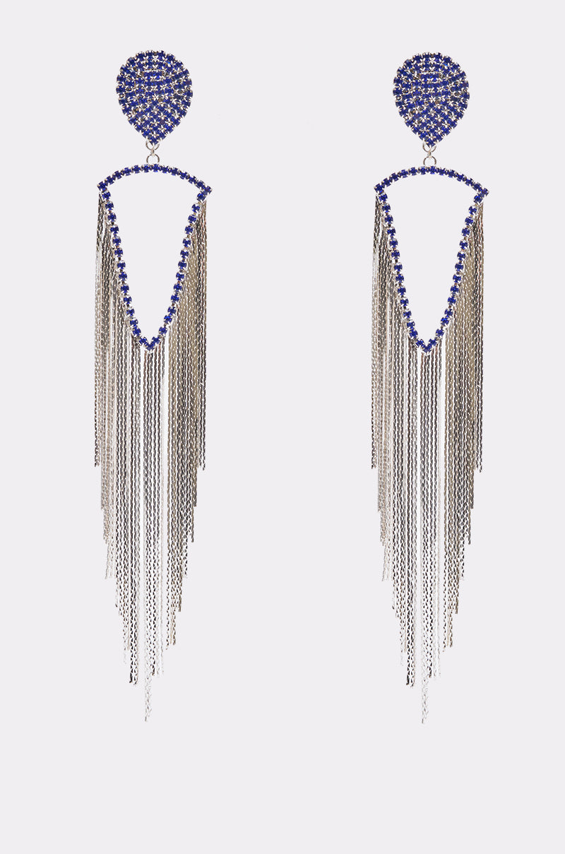 The DAYANNE EARRING features blue gemstones in circular and V-shape designs, accented by long cascading silver chain fringe for a bold, eye-catching accessory.