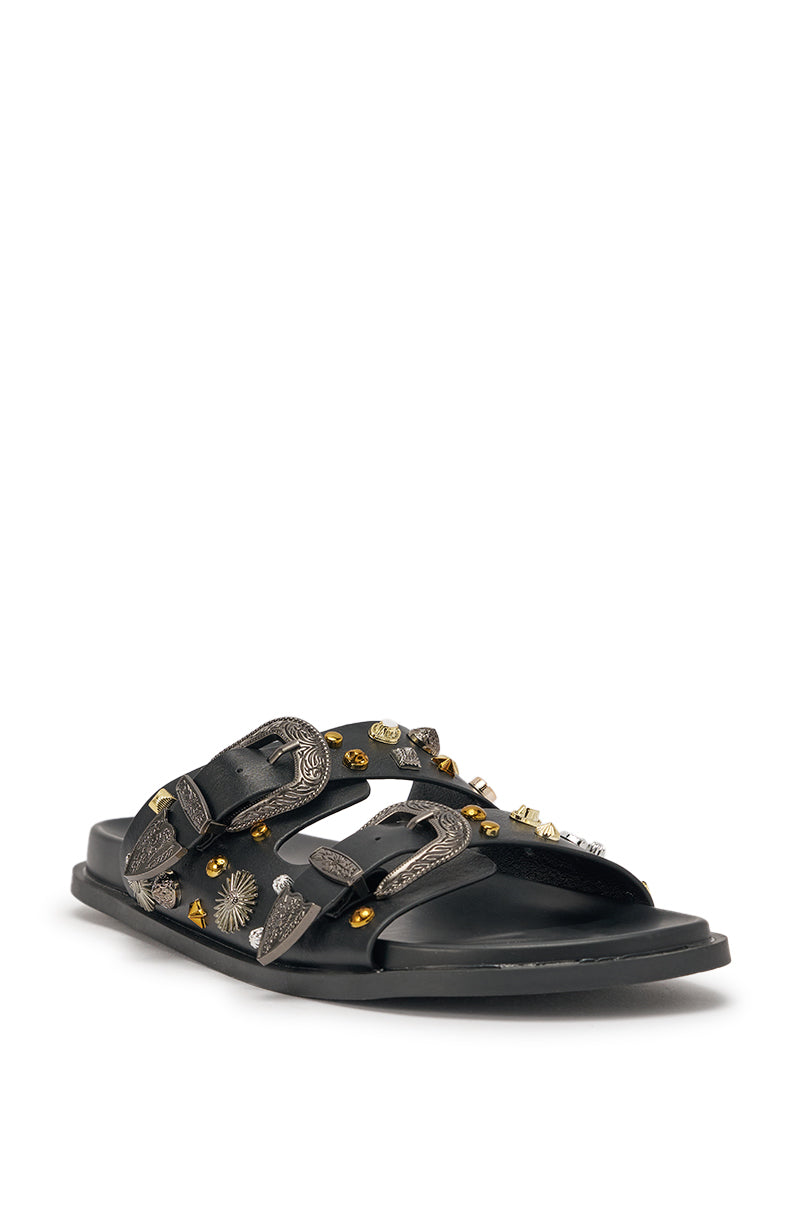 The AKIRA BARCLAY BLACK METAL EMBELLISHED SLIP ON FLAT SANDAL features black faux leather, two buckled straps with silver buckles, and metallic gold and silver studs—perfect for making a statement. 5