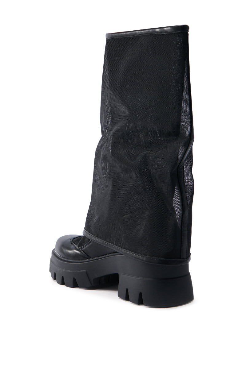 The AZALEA WANG BAYE BLACK MESH BOOT features a wide, loose-fitting mesh upper with a chunky sole. This mid-calf boot offers a chic contrast between its textured faux leather material and solid sole for an effortlessly stylish look.