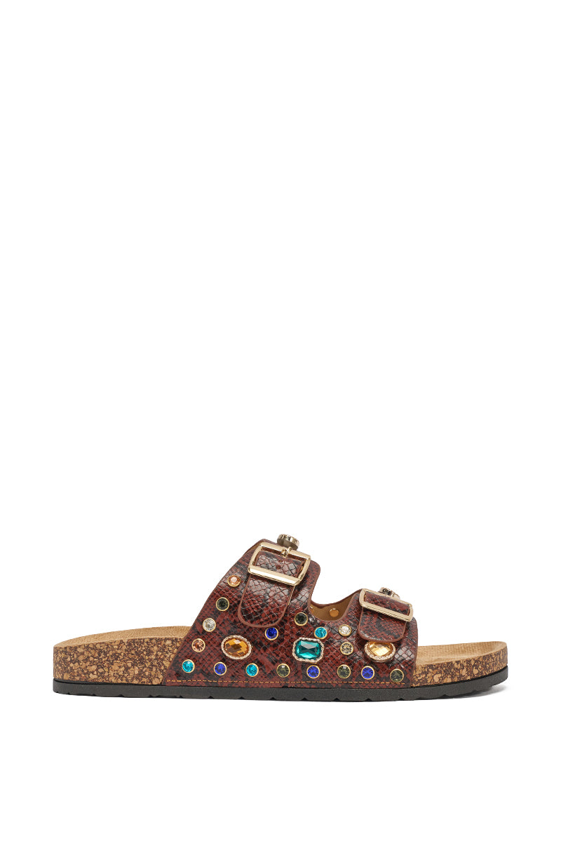 The AKIRA BAYLEAVES Brown Snake Embellished Flat Slip On Sandal features brown faux leather, a cork sole, two buckled straps, and is adorned with colorful gem-like embellishments. 6